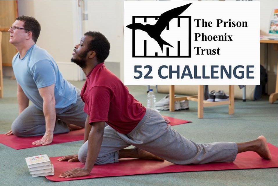 Image of men doing yoga in prison with 52 Challenge logo